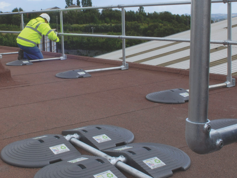 Worker setting up the Kee Guard